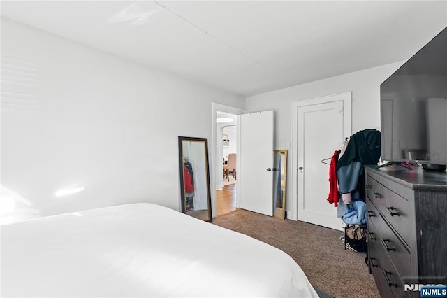 bedroom with dark carpet