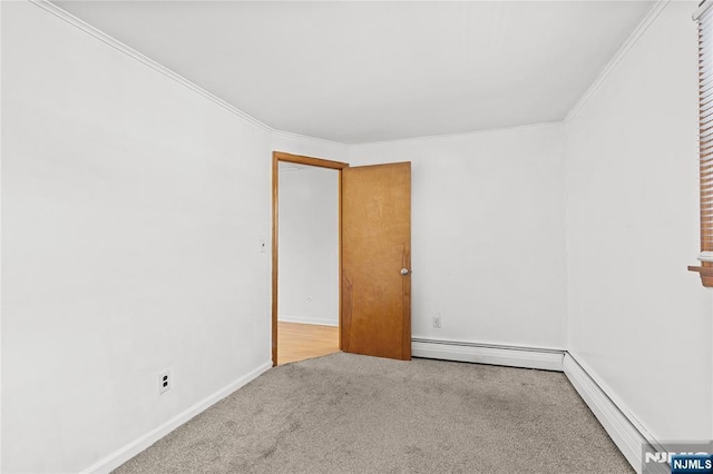 unfurnished room featuring crown molding, a baseboard radiator, and light colored carpet