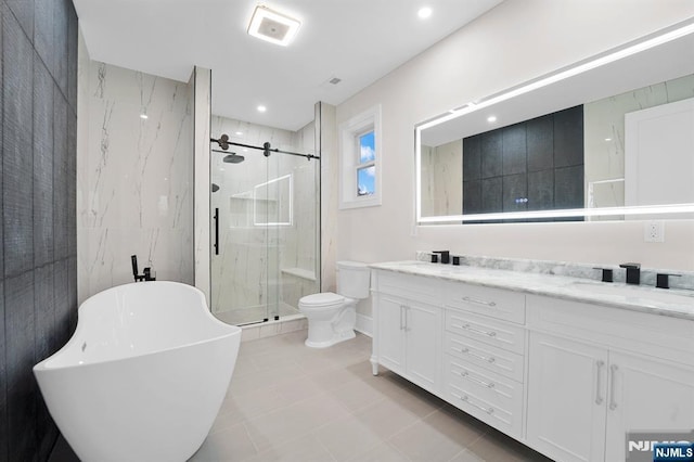 full bathroom featuring tile walls, plus walk in shower, vanity, and toilet