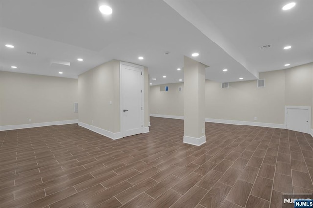 basement featuring dark hardwood / wood-style flooring