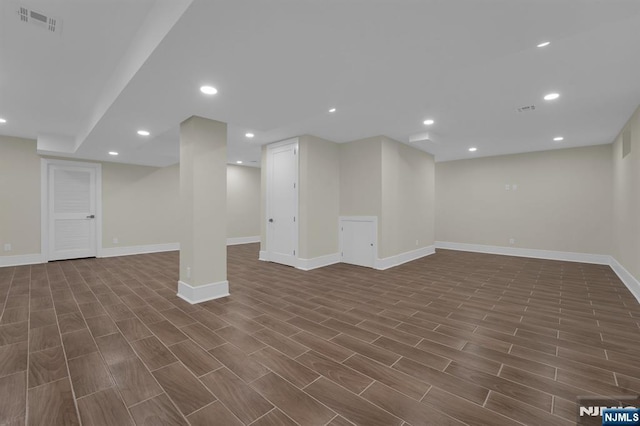 basement featuring dark hardwood / wood-style floors