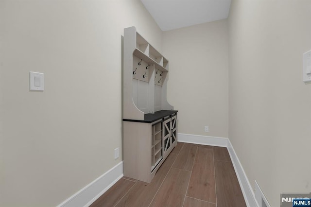 mudroom with light hardwood / wood-style flooring