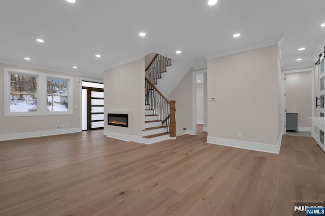 unfurnished living room featuring light hardwood / wood-style flooring