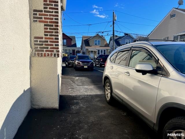 view of parking with a residential view