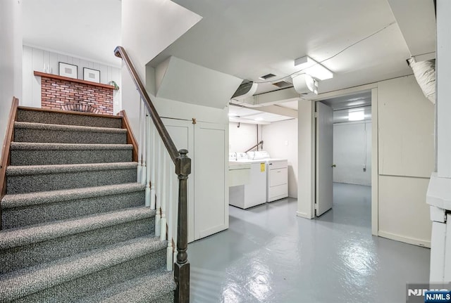 finished basement with stairway and independent washer and dryer