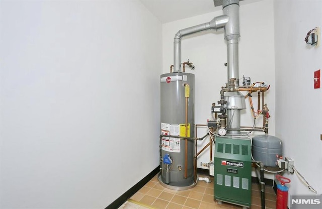 utility room featuring gas water heater