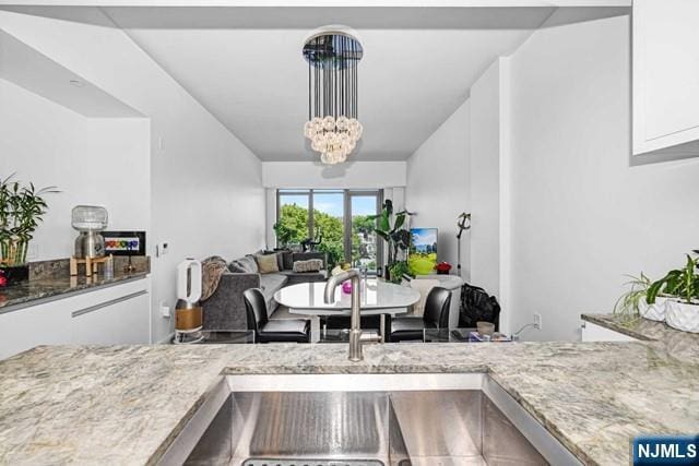 dining space with an inviting chandelier