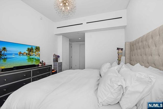 bedroom with an inviting chandelier