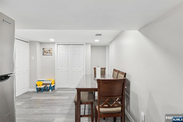 dining room featuring light hardwood / wood-style flooring