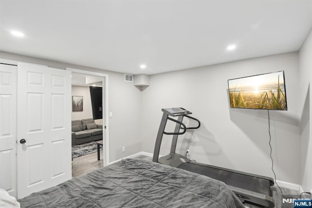 bedroom featuring hardwood / wood-style flooring and a closet