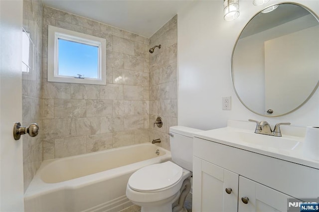 full bathroom featuring toilet, vanity, and tiled shower / bath combo