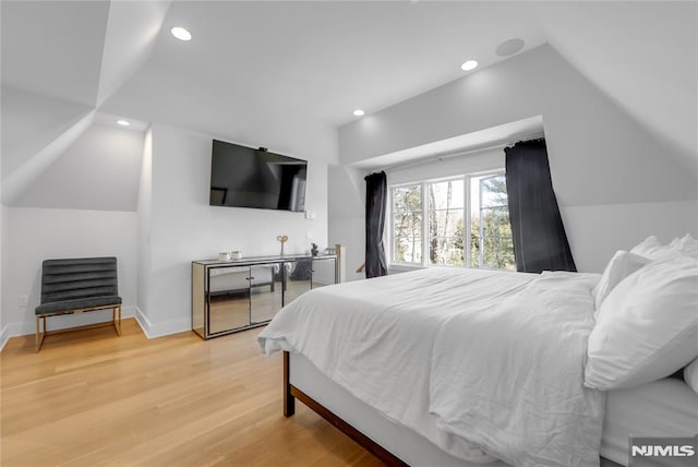 bedroom featuring vaulted ceiling, recessed lighting, baseboards, and wood finished floors