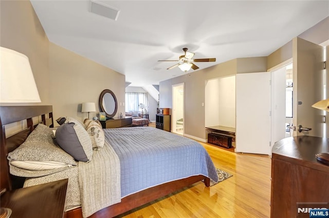 bedroom with ceiling fan and wood finished floors