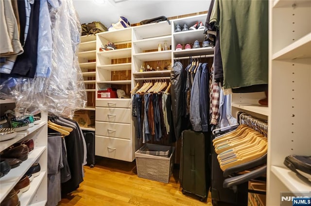 walk in closet featuring light wood-style flooring