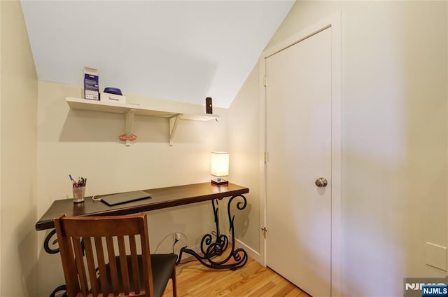 home office with light wood finished floors