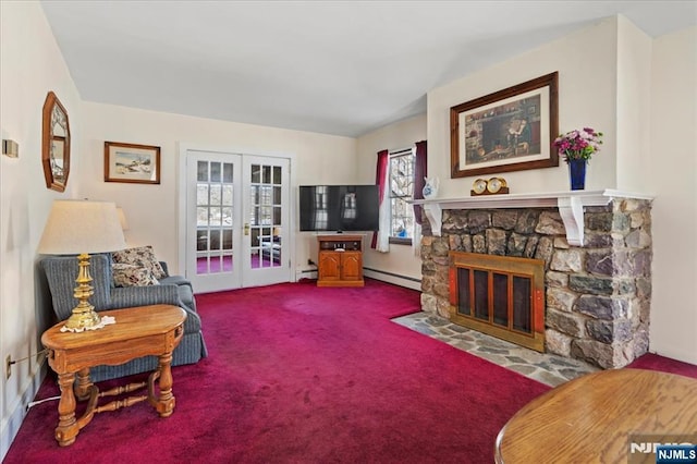 sitting room featuring carpet floors, french doors, baseboard heating, a baseboard heating unit, and a stone fireplace