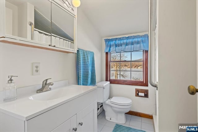 full bath with baseboards, vanity, toilet, and tile patterned floors