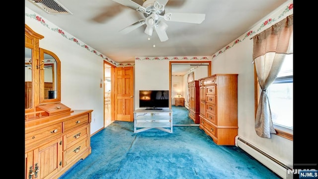 bedroom featuring visible vents, a baseboard heating unit, ceiling fan, and carpet flooring