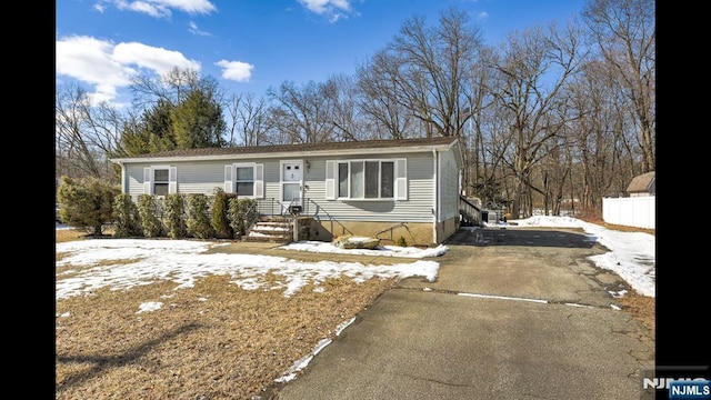 view of front of house with aphalt driveway