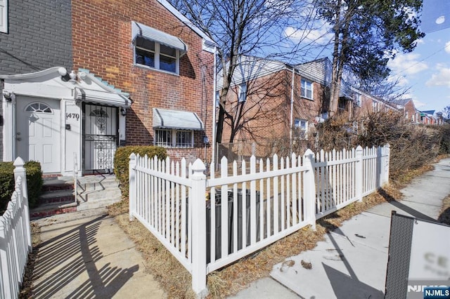 exterior space featuring a fenced front yard