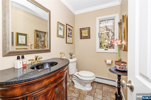 bathroom with toilet, vanity, baseboards, ornamental molding, and baseboard heating