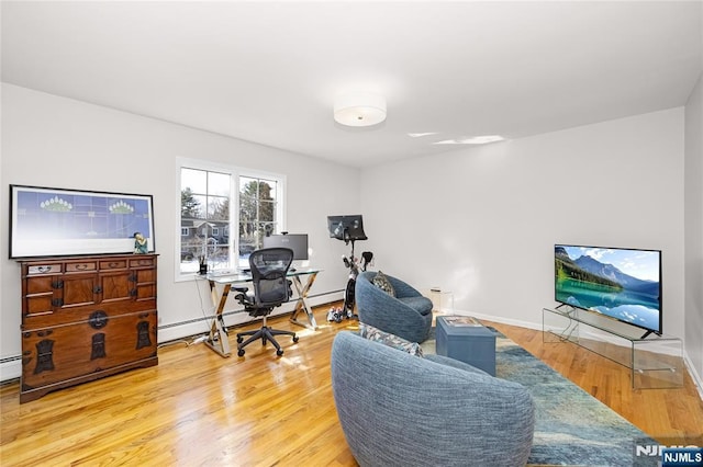 office area featuring baseboards and wood finished floors