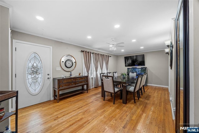 dining room featuring ceiling fan, ornamental molding, and light hardwood / wood-style floors