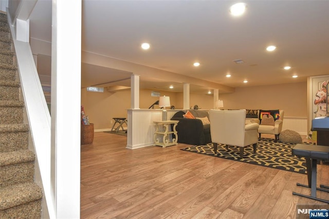 living area with stairway, recessed lighting, light wood-type flooring, and visible vents