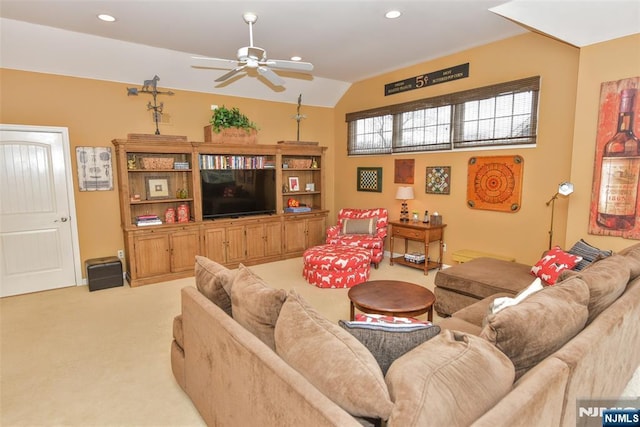 living area with recessed lighting, light colored carpet, ceiling fan, and vaulted ceiling