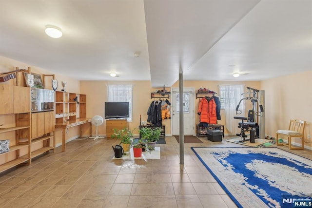 workout room featuring tile patterned floors