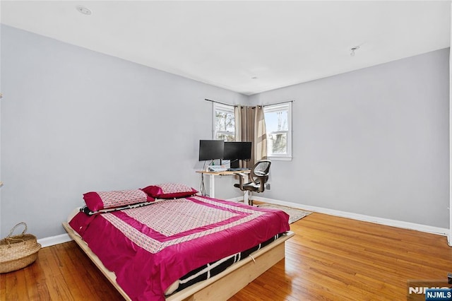 bedroom featuring wood-type flooring