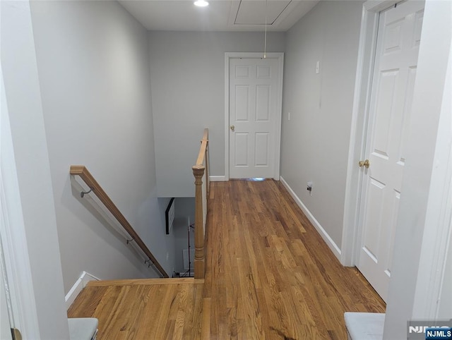 hall with hardwood / wood-style flooring