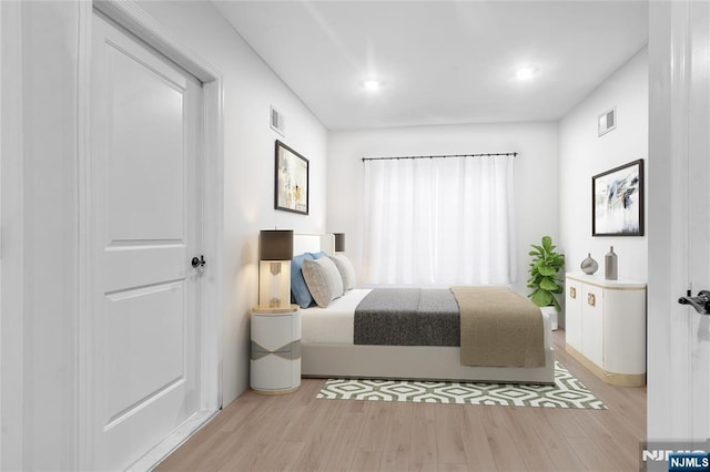 bedroom featuring light hardwood / wood-style floors