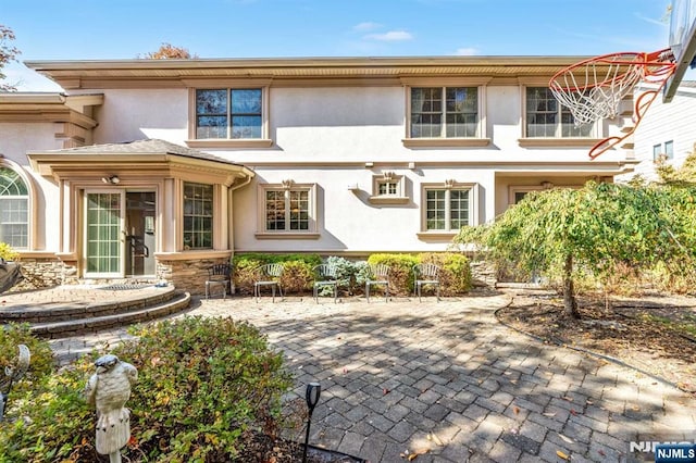 rear view of property featuring a patio area