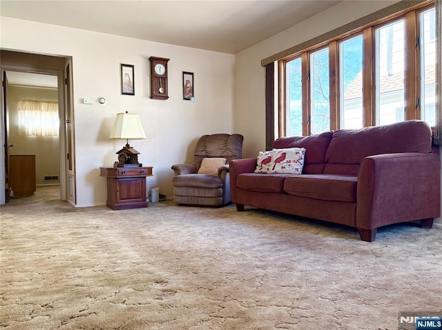 carpeted living room featuring plenty of natural light