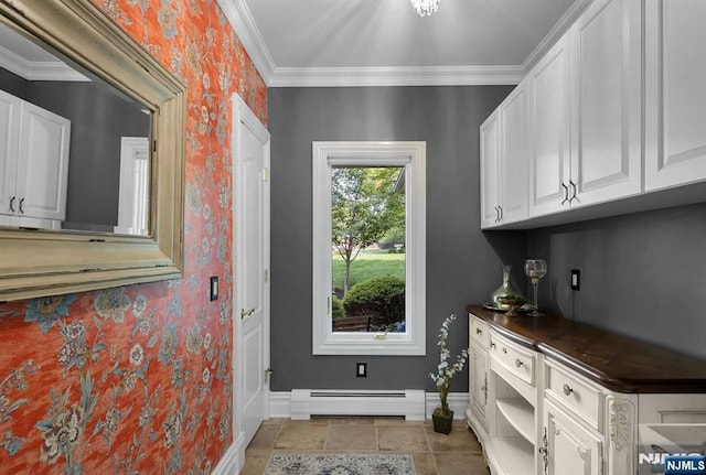 laundry room featuring light tile patterned floors, wallpapered walls, baseboards, ornamental molding, and a baseboard heating unit