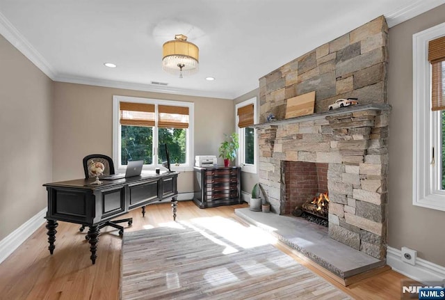 office featuring ornamental molding, baseboards, and light wood finished floors