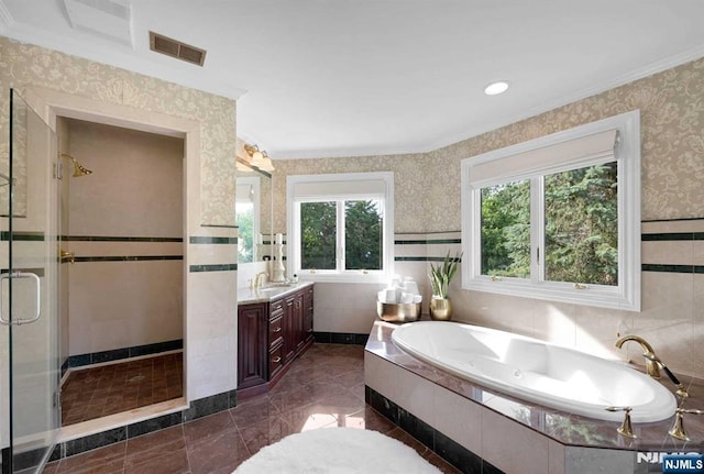 bathroom with visible vents, a stall shower, wainscoting, vanity, and wallpapered walls