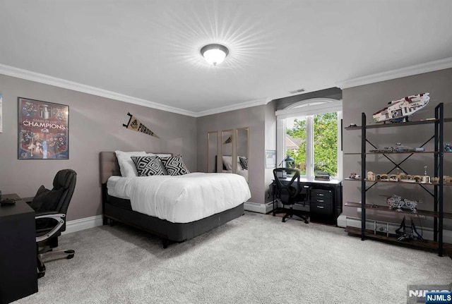 bedroom featuring carpet floors, crown molding, and baseboards