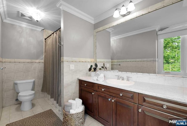 bathroom featuring toilet, tile patterned flooring, ornamental molding, and vanity