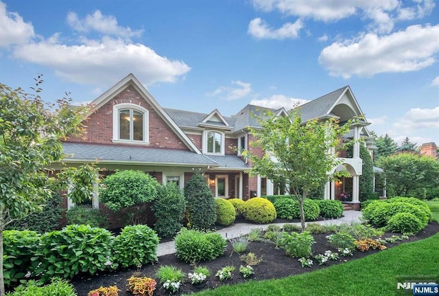 view of front of home featuring brick siding