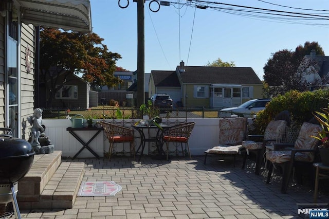 view of patio featuring a grill