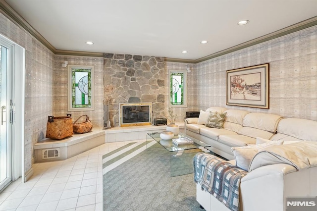 living area with a stone fireplace, light tile patterned flooring, recessed lighting, and crown molding