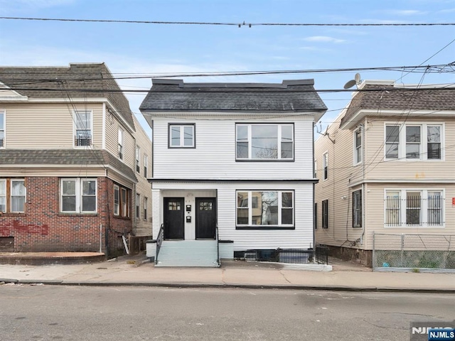 view of front of house featuring roof with shingles