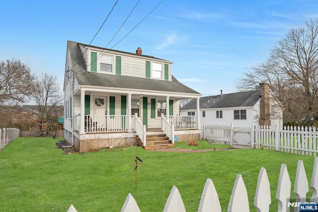 view of front facade with a fenced front yard, covered porch, a chimney, and a front lawn