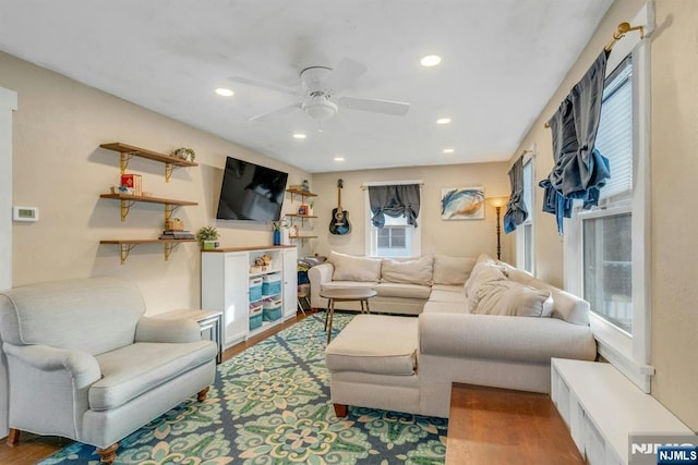 living area featuring ceiling fan, wood finished floors, and recessed lighting