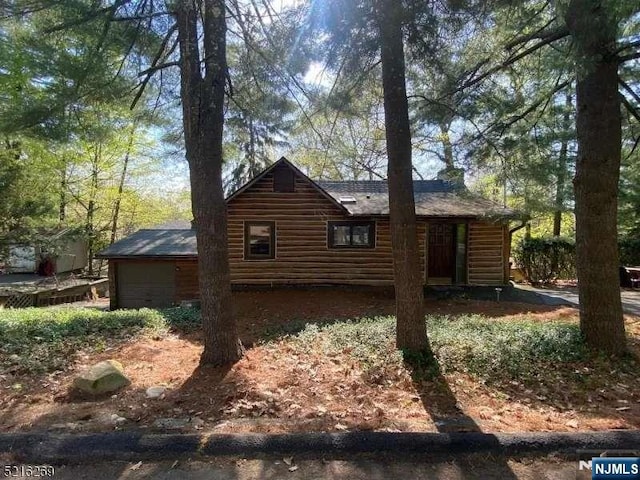 view of home's exterior featuring log veneer siding