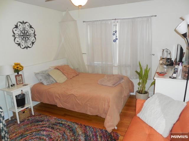 bedroom with wood finished floors