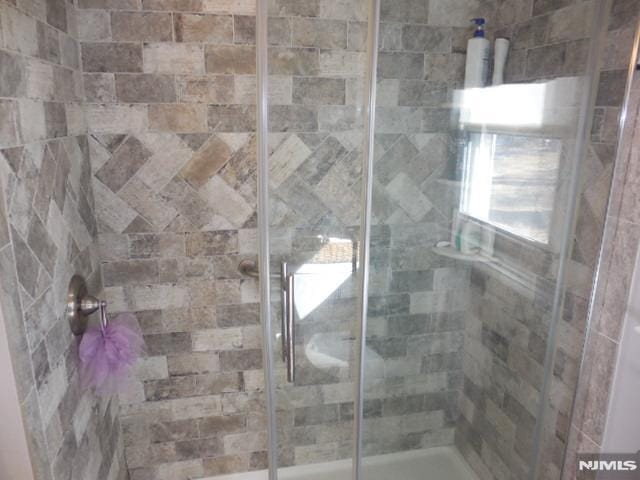 full bathroom featuring a stall shower