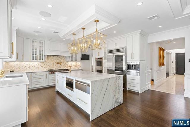 kitchen with white cabinets, visible vents, and appliances with stainless steel finishes